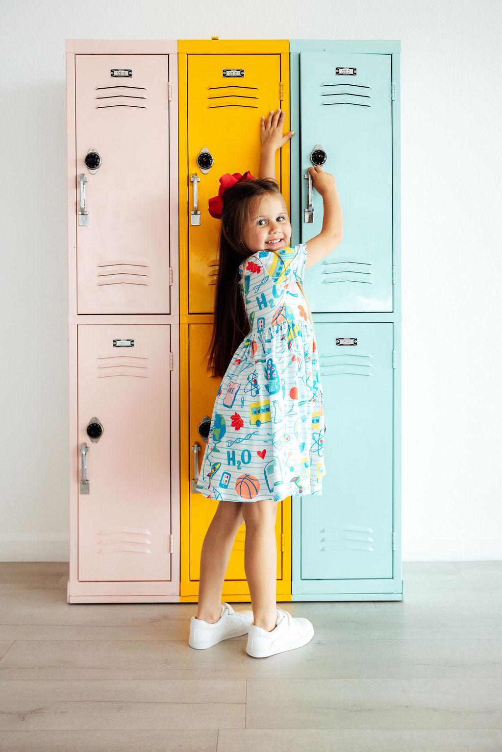 Girls' light blue science-print twirl dress, knee-length with short sleeves
