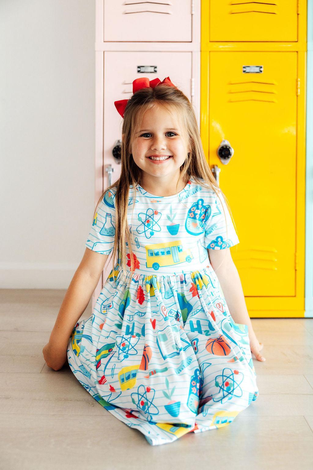 Girls' short-sleeve twirl dress with colorful astronomy, school, and atom graphics
