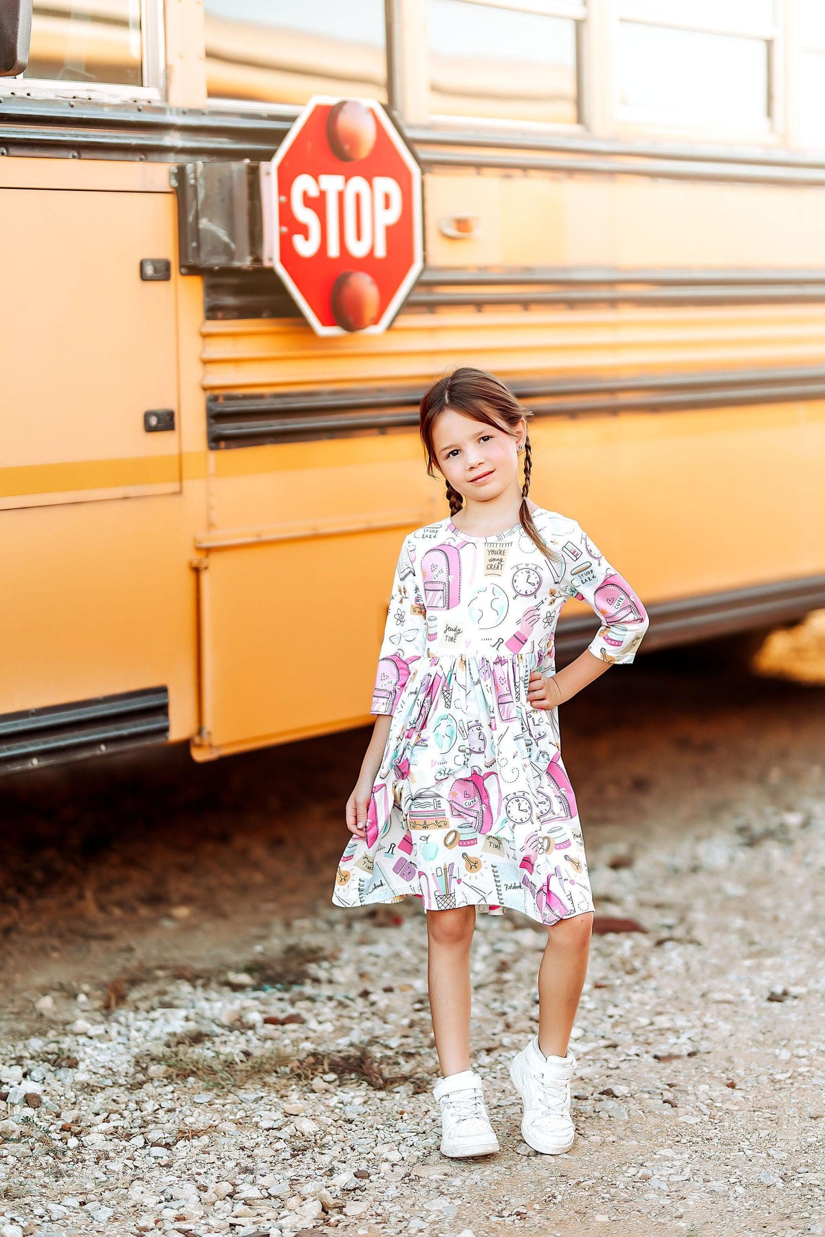 Girls' white 3/4-sleeve twirl dress with colorful school-themed graphic print