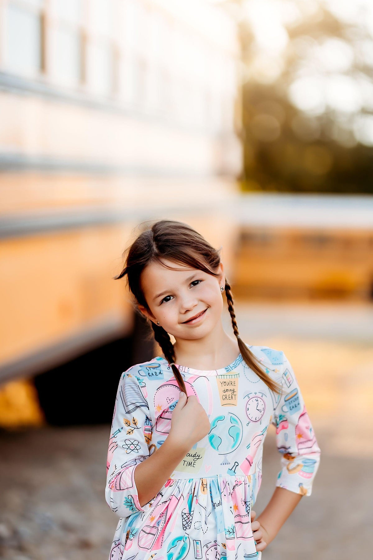 Girls' white 3/4-sleeve twirl dress with pastel school icons and gathered skirt