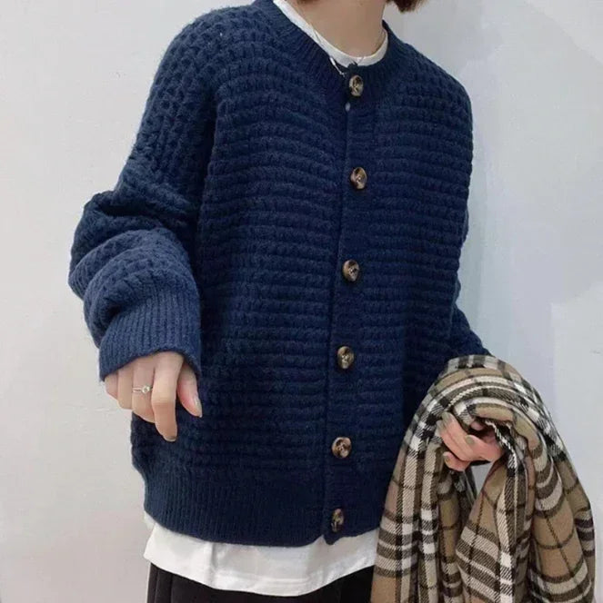 Navy knit button-front cardigan with ribbed cuffs and straight hem