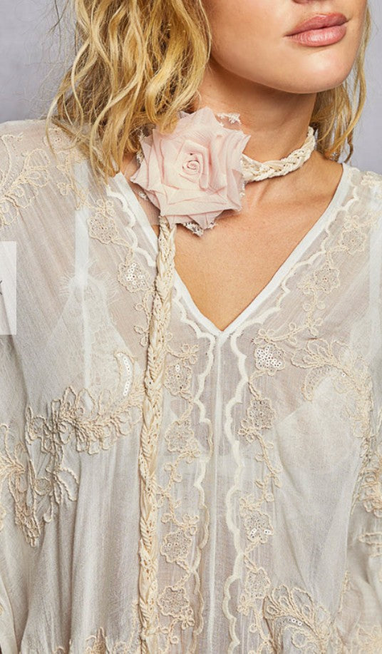 Cream lace tie-style belt with braided cord and pink fabric rose applique