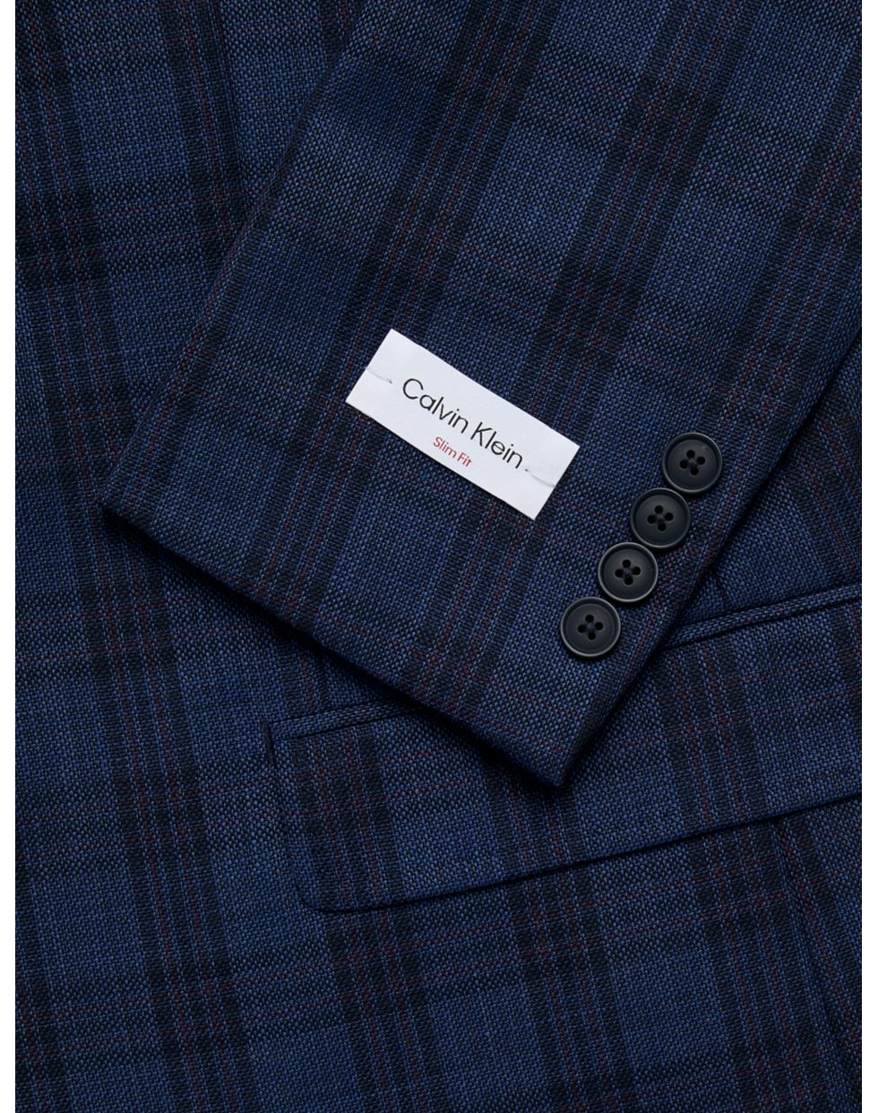Calvin Klein label and three-button cuff on blue plaid wool sport coat