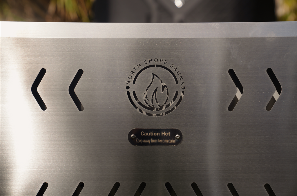 Stainless mini tent sauna stove close-up with caution hot label and logo