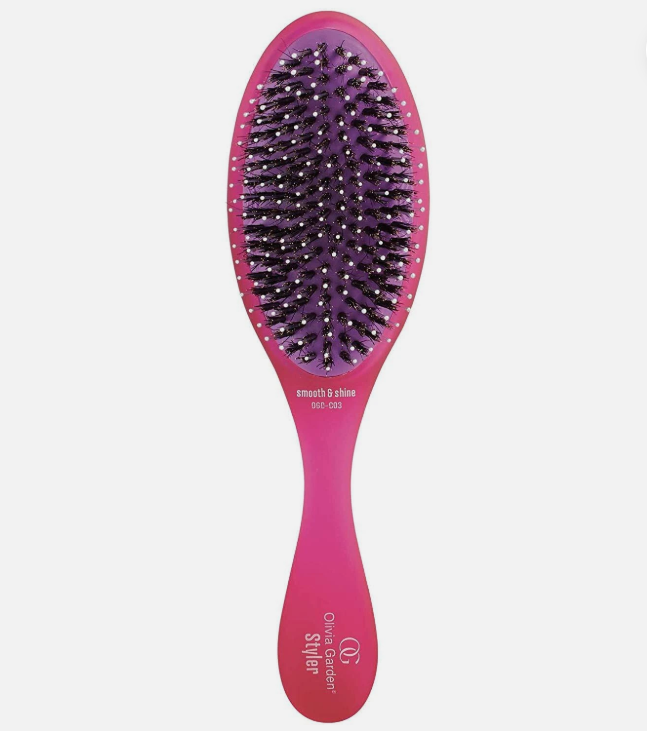 Purple oval hair brush with black bristle pins and pink handle, smooth-shine style.