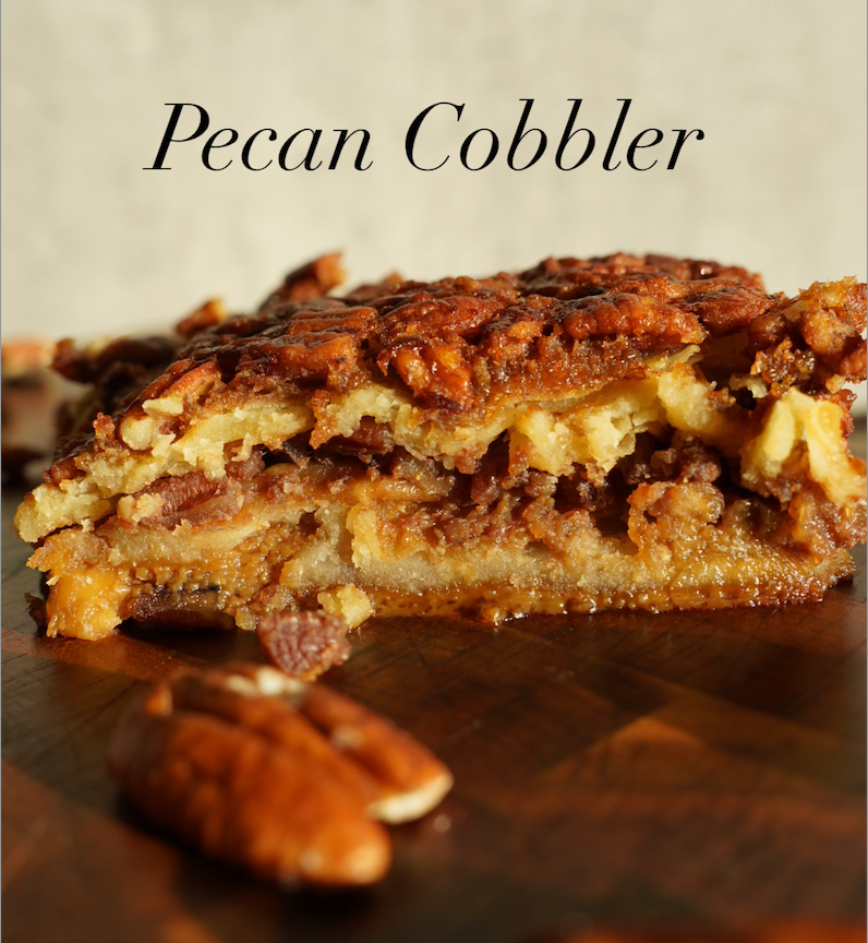 Pecan cobbler dessert with browned crumb topping and visible pecan pieces