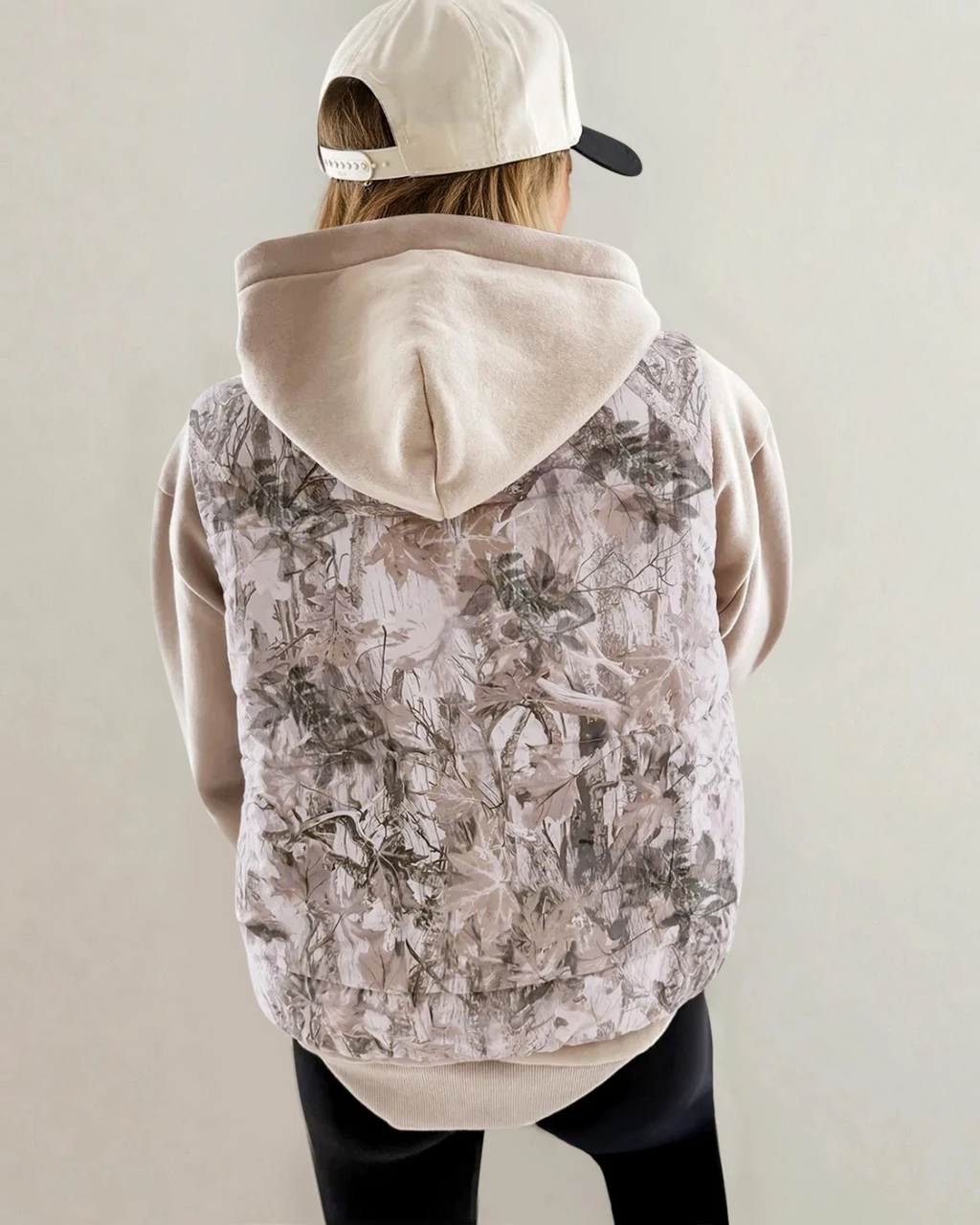 Beige camouflage leaf-print puffer vest, back view with zip front