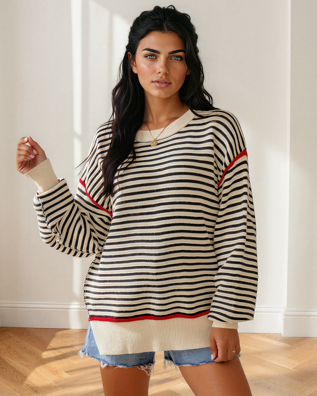 Oversized striped knit sweater with ribbed crew neck, drop shoulders, and red edge trim
