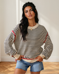 Oversized long-sleeve striped sweater with ribbed cuffs and hem, red trim detail