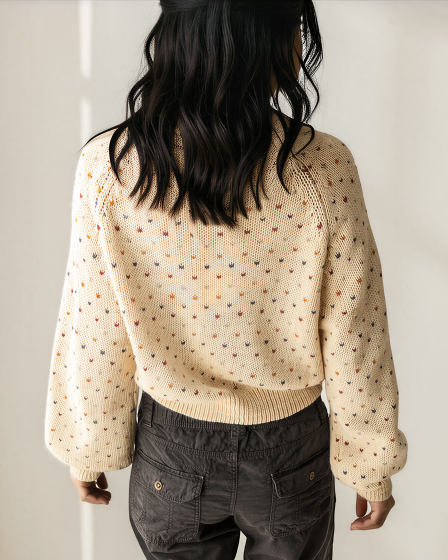 Back view of cream speckled knit cardigan with long sleeves and ribbed hem