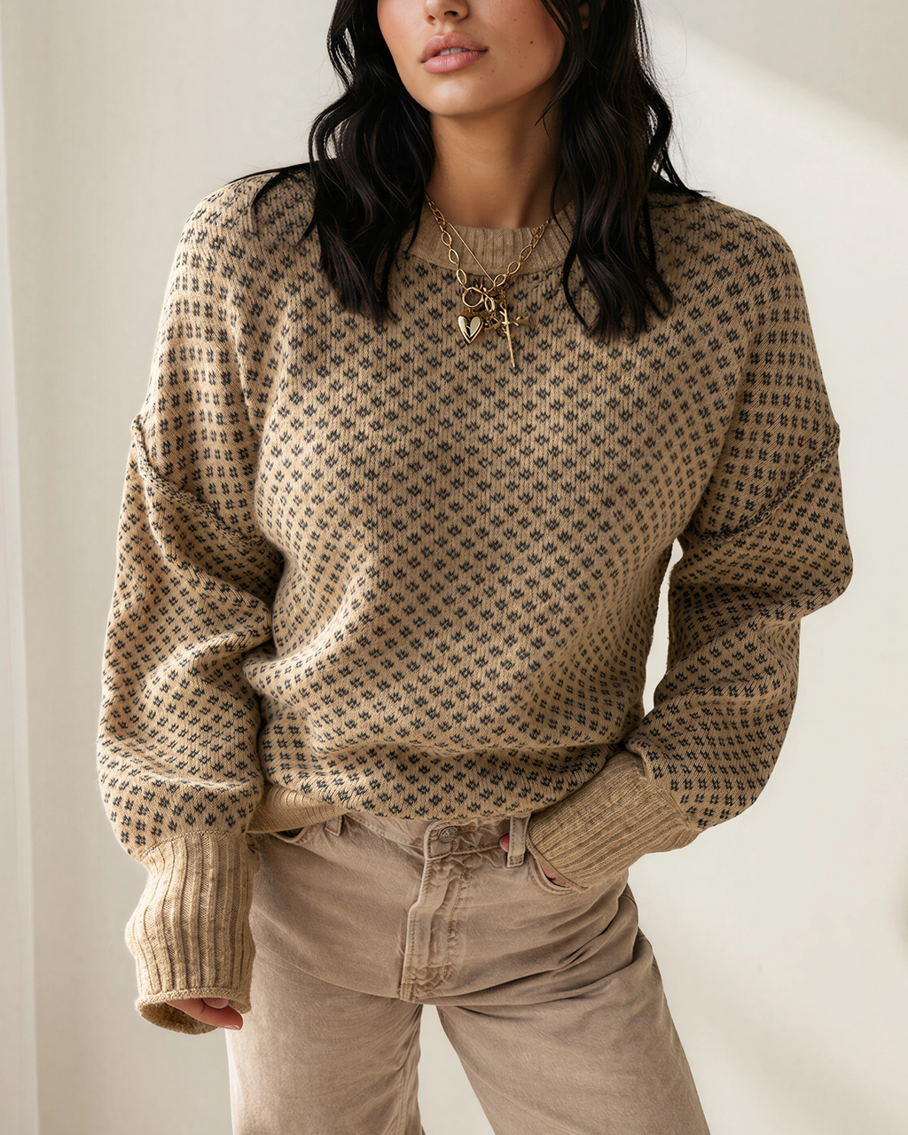 Beige geometric knit pullover with drop shoulders and ribbed knit cuffs