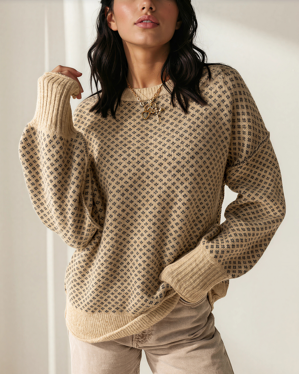 Beige geometric knit pullover with loose drop-shoulder fit and ribbed cuffs
