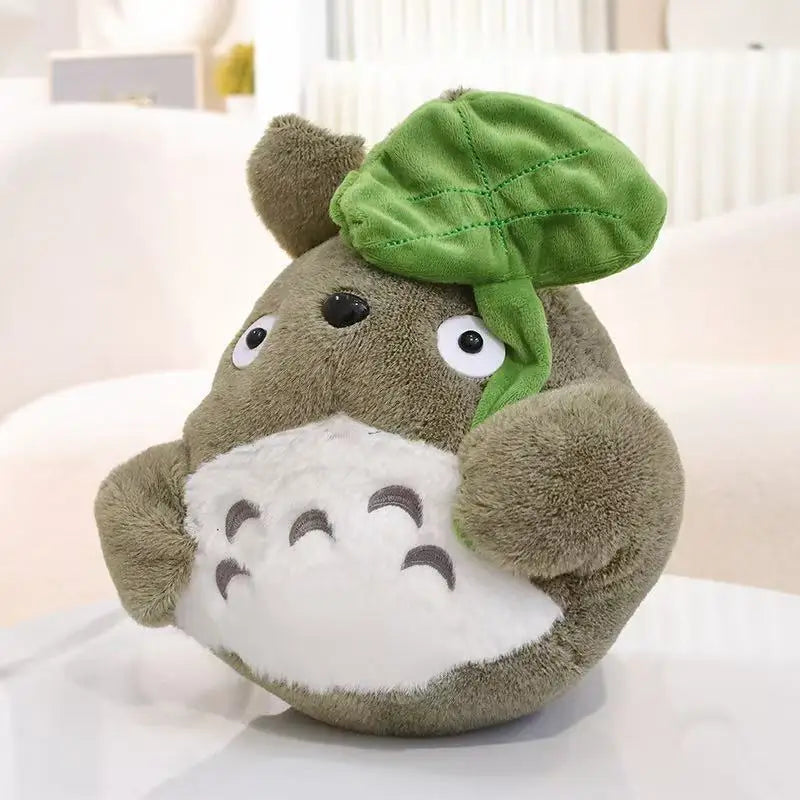 Cartoon forest creature plush pillow, brown plush with green leaf cap and white belly