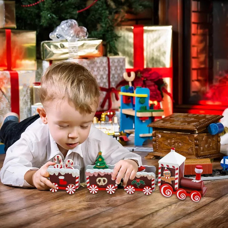Mini painted wooden Christmas train set with chimney and caboose on a table