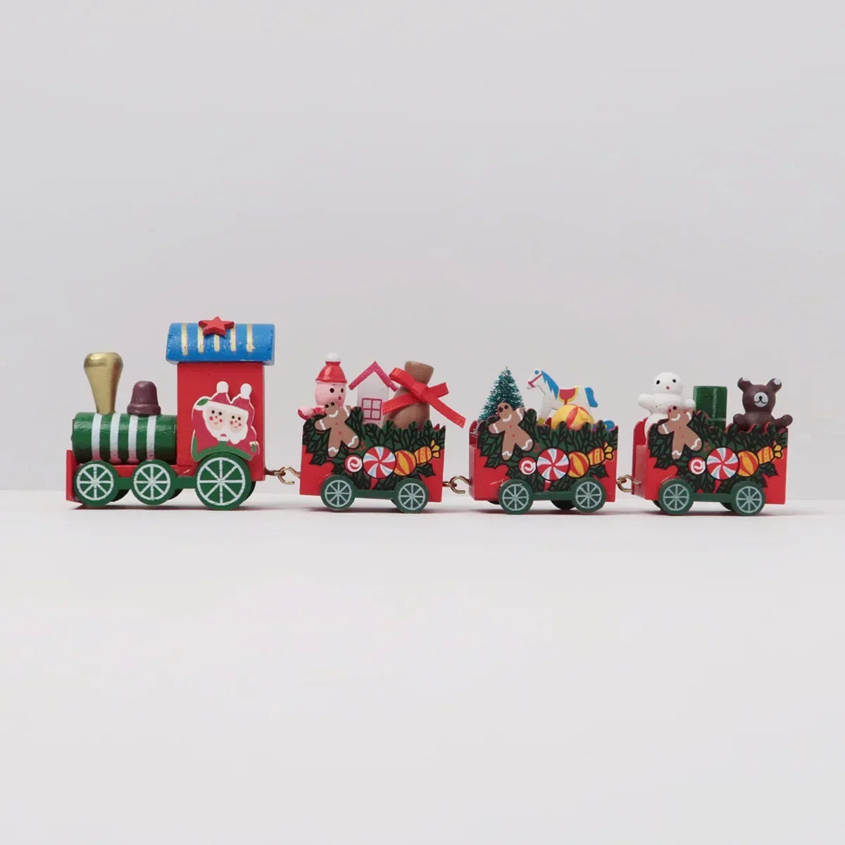Painted wooden Christmas train set with bear, snowman, and festive boxcar cars