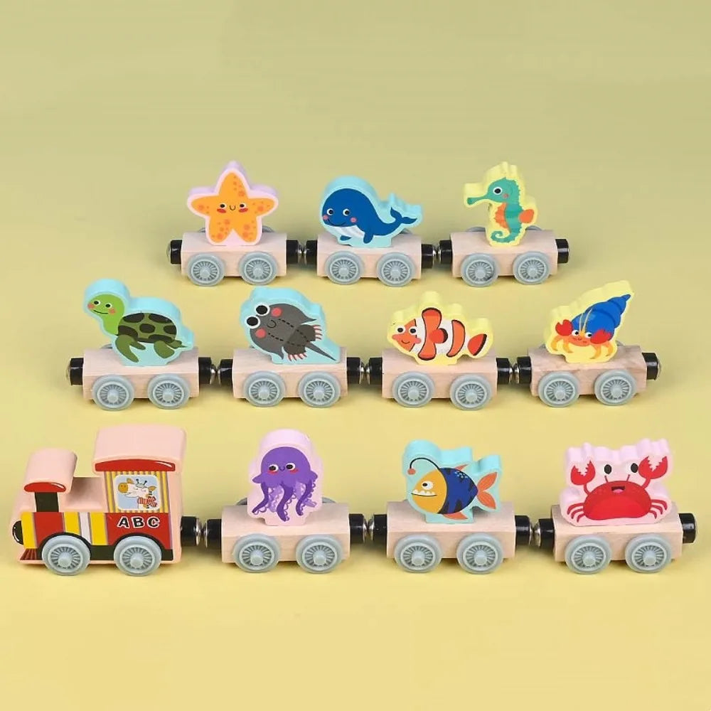 Wooden magnetic train set with ocean animal block toppers, including whale, crab, and octopus