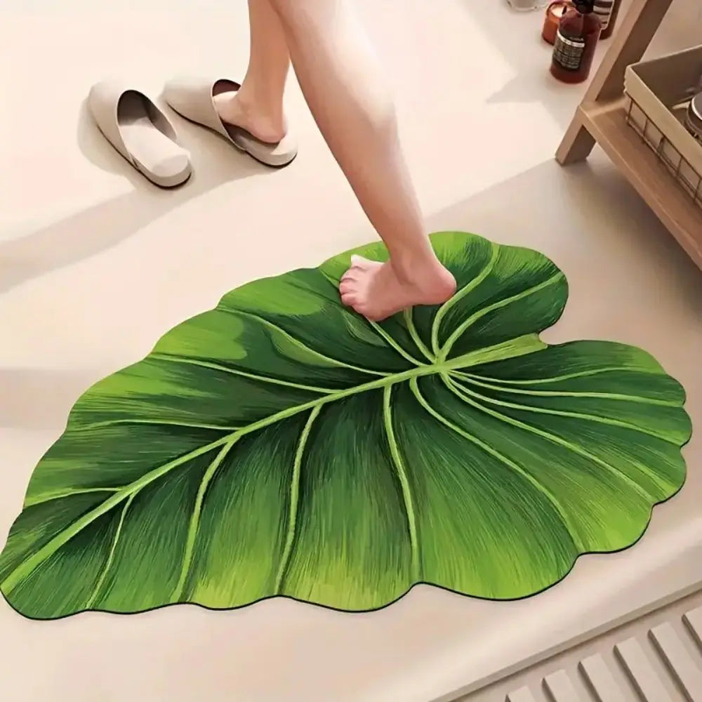 Green leaf-shaped bath mat rug with veined leaf pattern