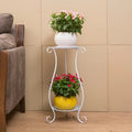 White two-tier flower plant stand with scroll legs supporting two potted plants