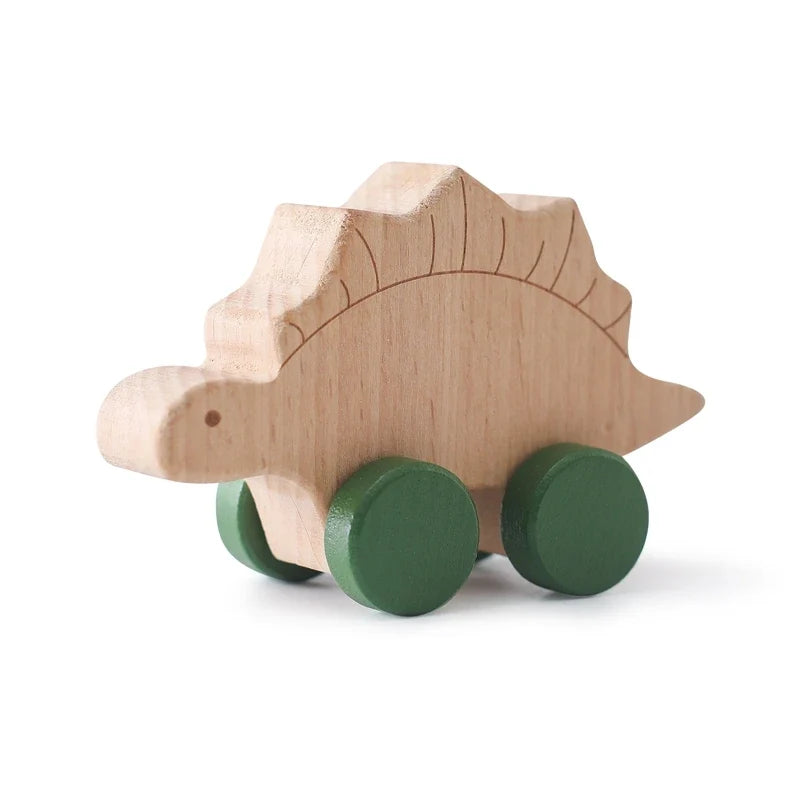Wooden dinosaur teether car with green wheels and carved body details