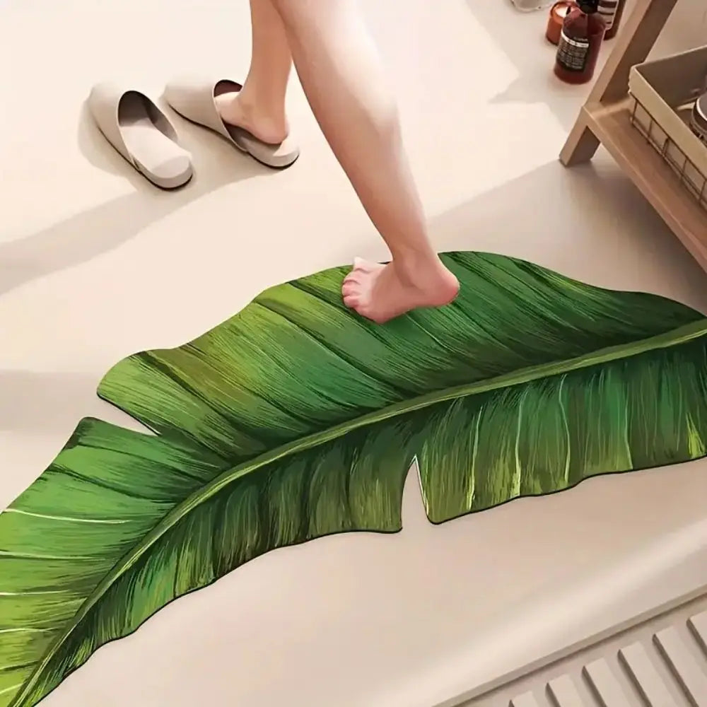 Green leaf-shaped bath mat rug with realistic veined leaf design