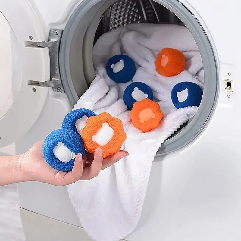 Laundry pet hair remover balls in washer drum, blue and orange plush bear shapes