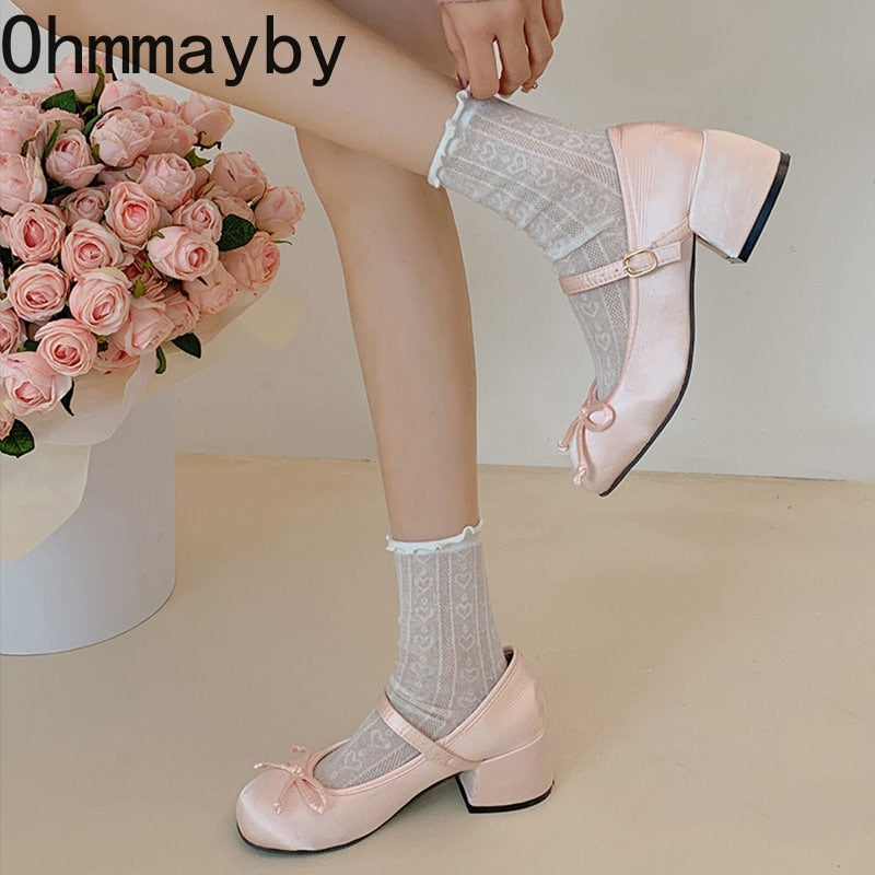 Blush pink Mary Jane ballet flats with ankle strap and bow, with lace socks