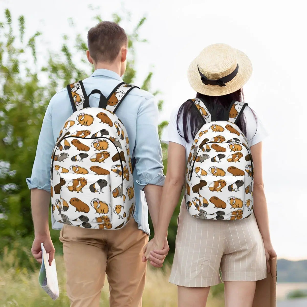 Guinea pig print backpack worn by two people; white fabric with black straps