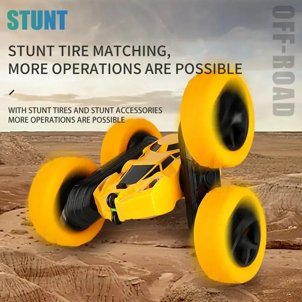 Yellow RC stunt car with large tread wheels and black rugged side tires