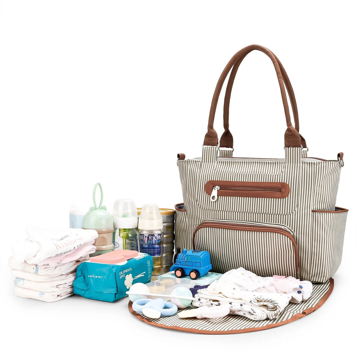 Beige striped diaper bag open with supplies laid out on the included changing pad