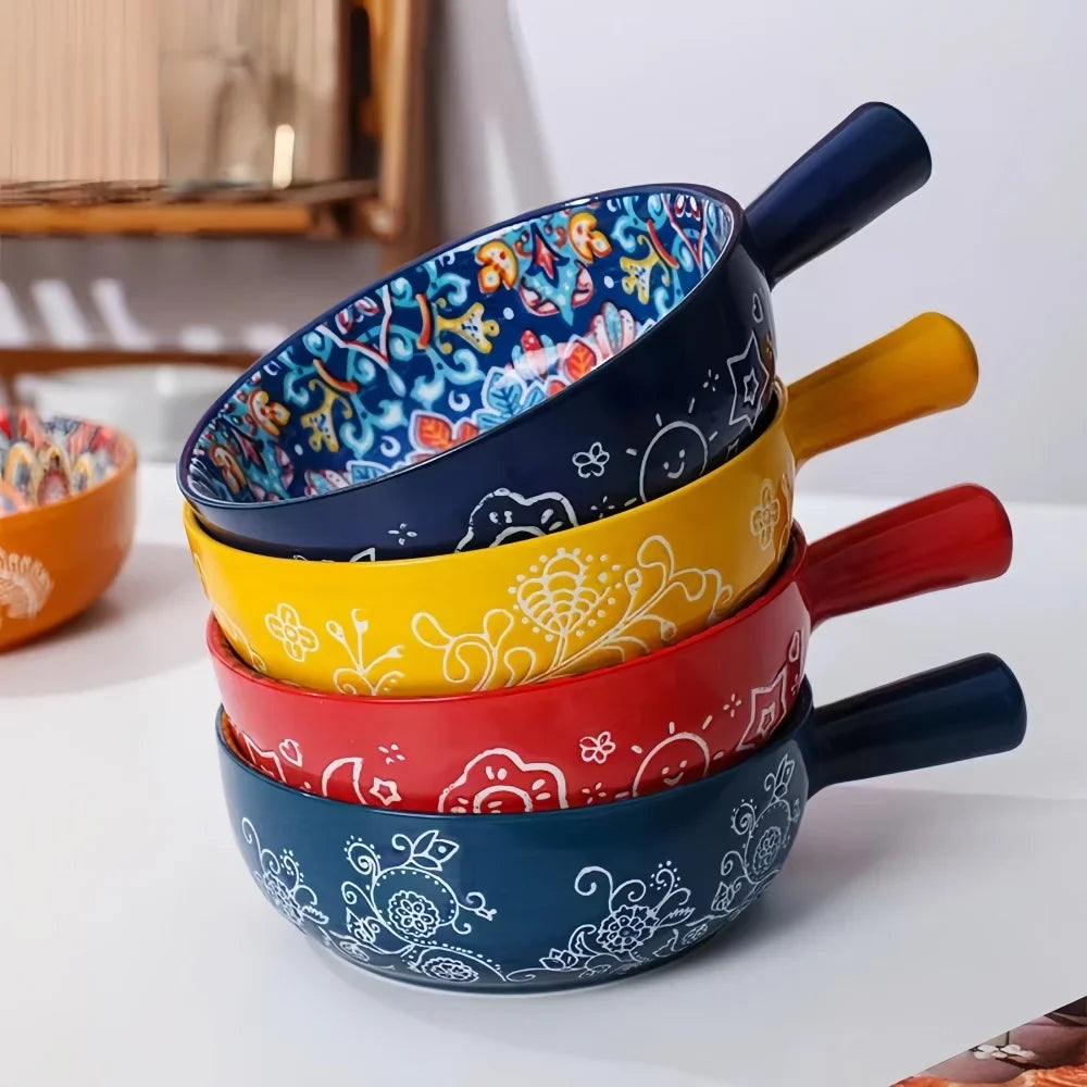 Stacked ceramic salad bowls in navy, yellow, and red with white line patterns