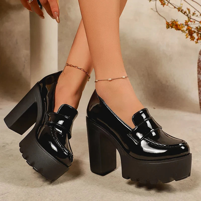 Black patent leather chunky-heel platform loafers with front strap