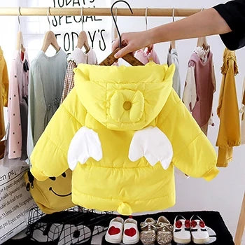 Yellow unicorn-themed hooded puffer jacket with plush ears and wing-style trim