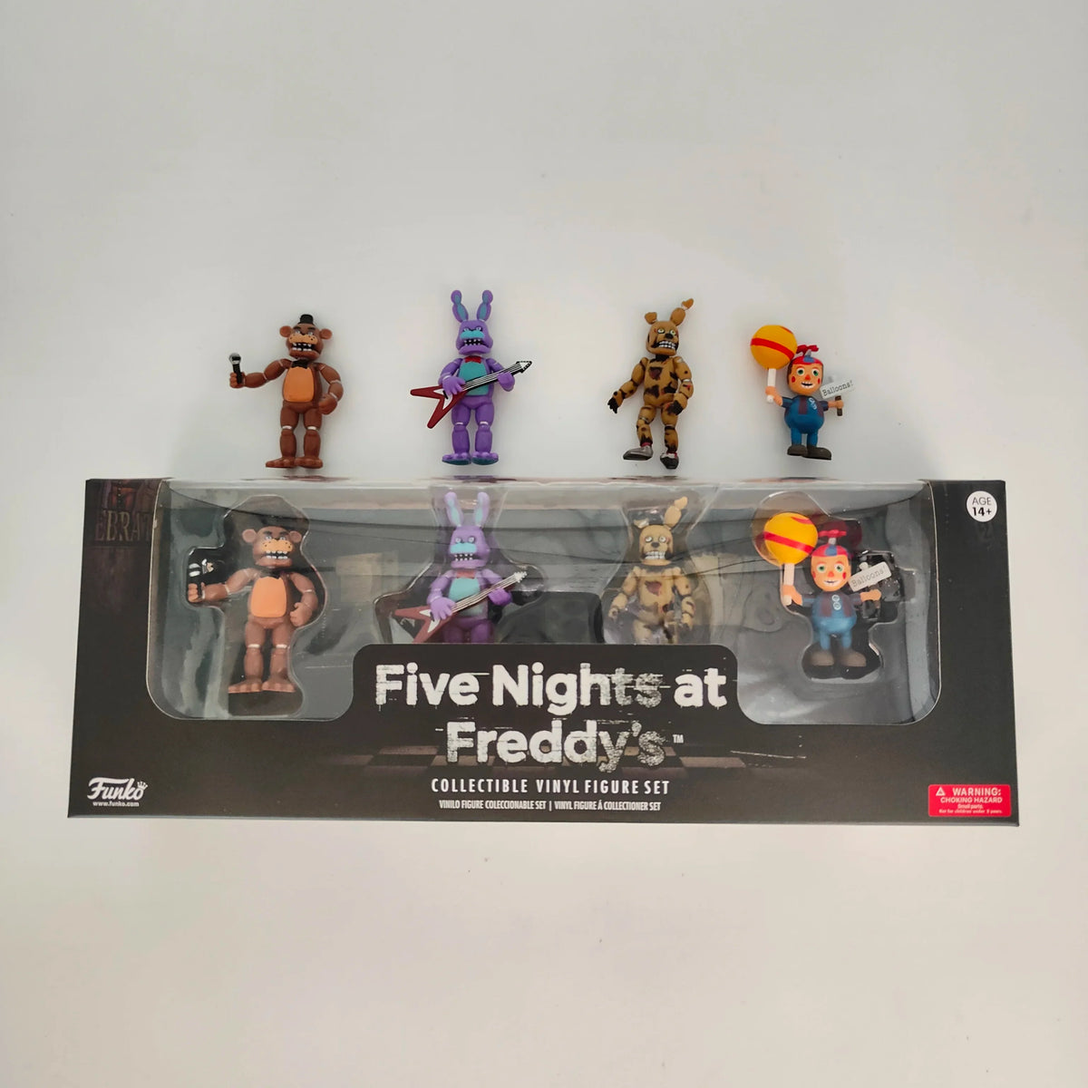 Collectible vinyl action figure set window box with four figures displayed on top