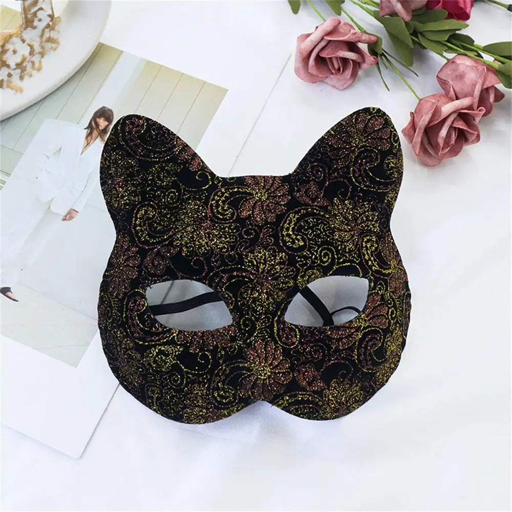 Gold-and-black patterned cat masquerade mask with cutout eyes