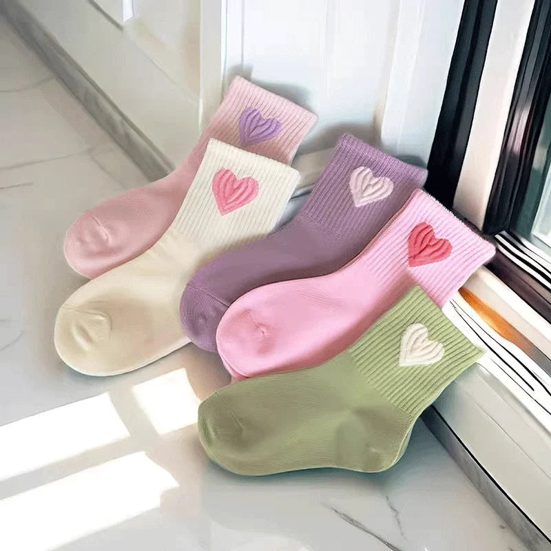 Girls mid-calf socks set with pink, purple, and cream hearts on ribbed knit