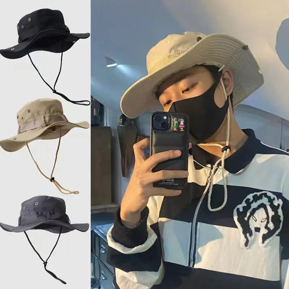Beige wide-brim bucket hat with chin cord, worn with a protective face mask