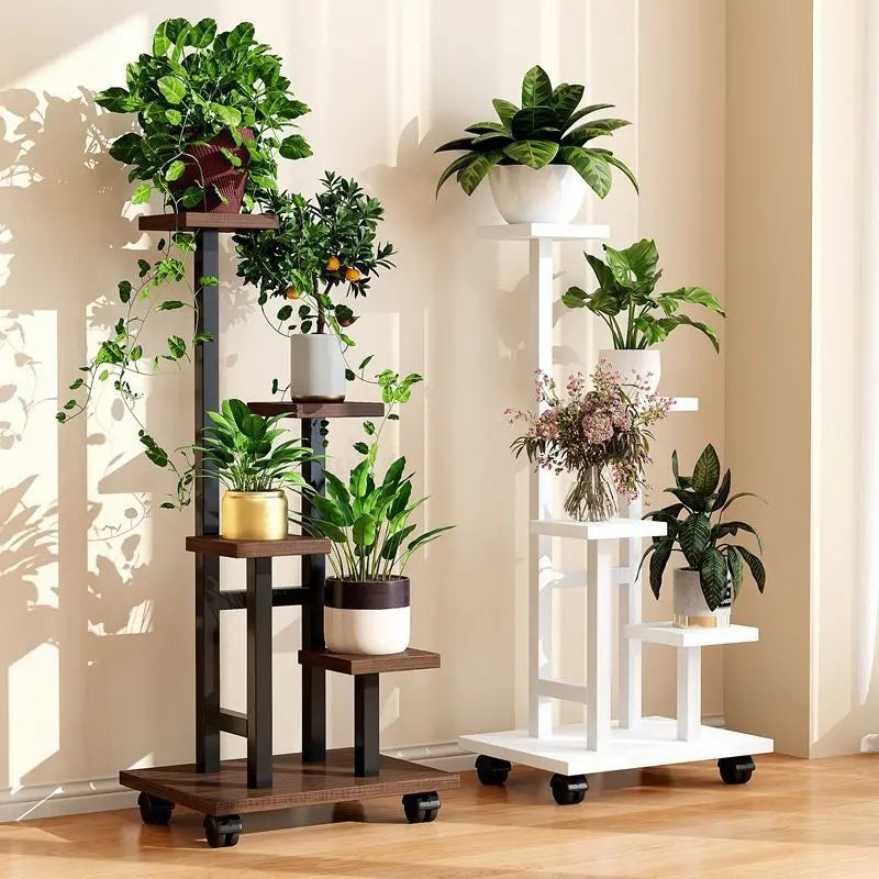 Rolling plant stand with dark frame, tiered wooden shelves, and potted greenery.