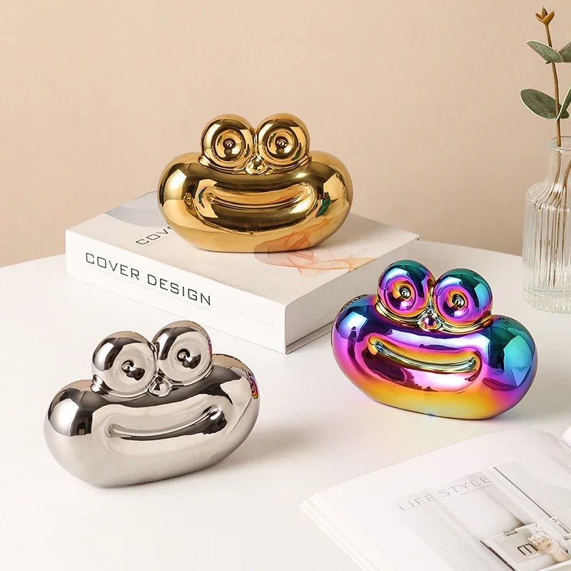 Saussage-shaped ceramic ornaments in gold, silver, and rainbow iridescent finishes