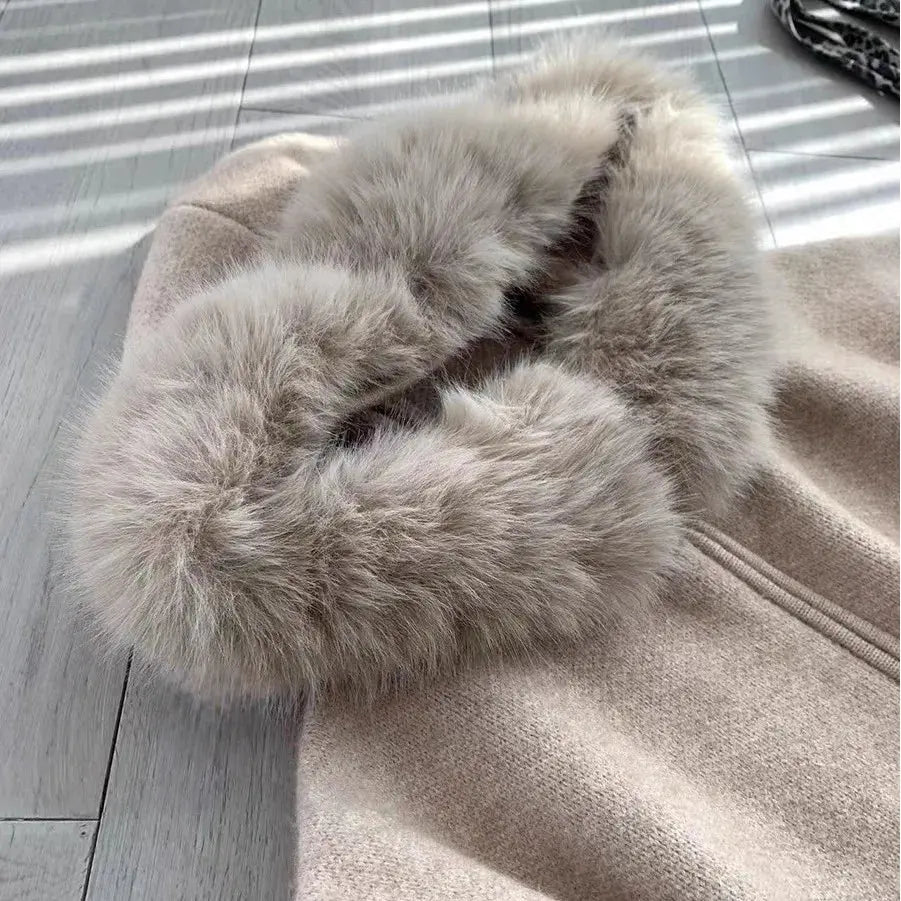Gray sweater jacket with plush faux-fur trim at collar and textured knit body