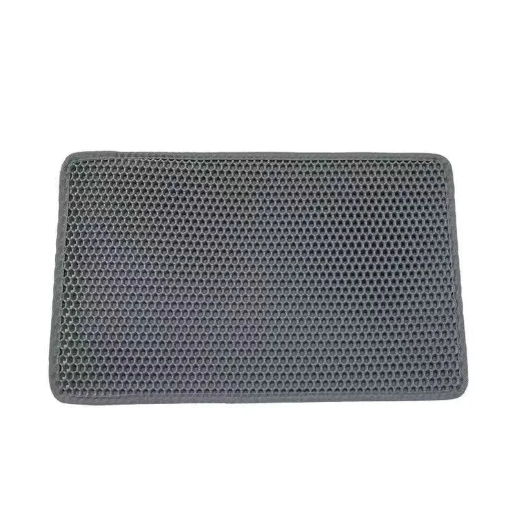 Rectangular gray cat litter mat with hex-pattern grid texture and stitched edges