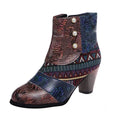 Women’s ankle boots with short block heel, embossed floral texture, and snap buttons