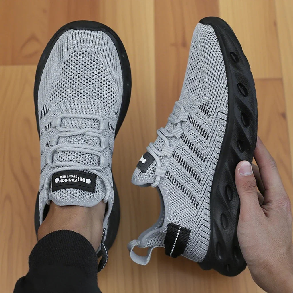 Breathable knit sports shoes, light grey upper with black thick sole, lace-up style