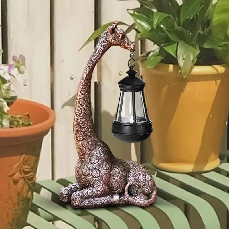 Brown resin giraffe figurine solar lantern standing near potted greenery