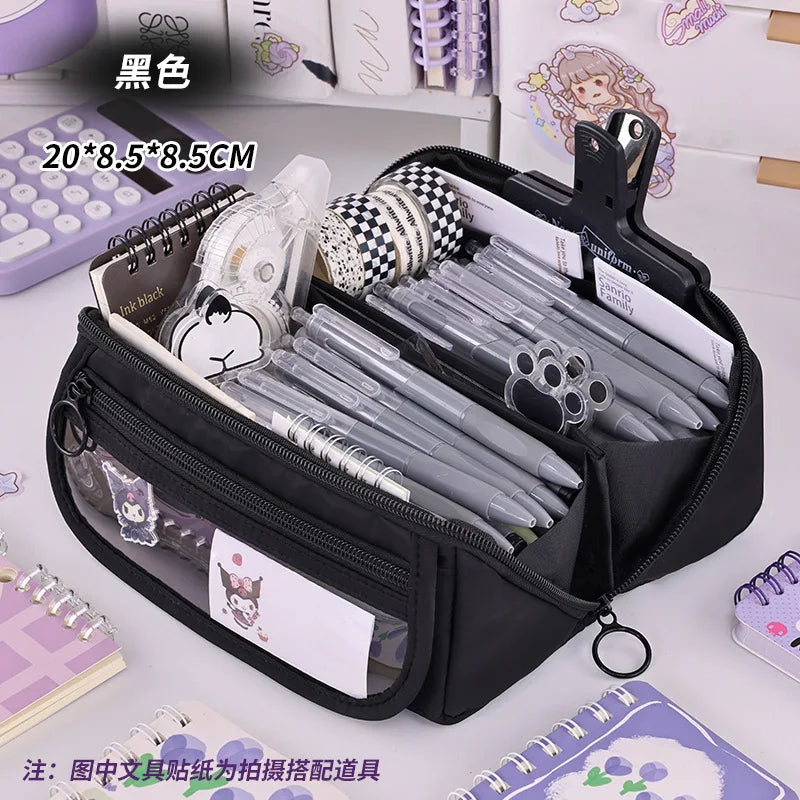 Black zip pencil case open with pens, markers, and front character patch panel
