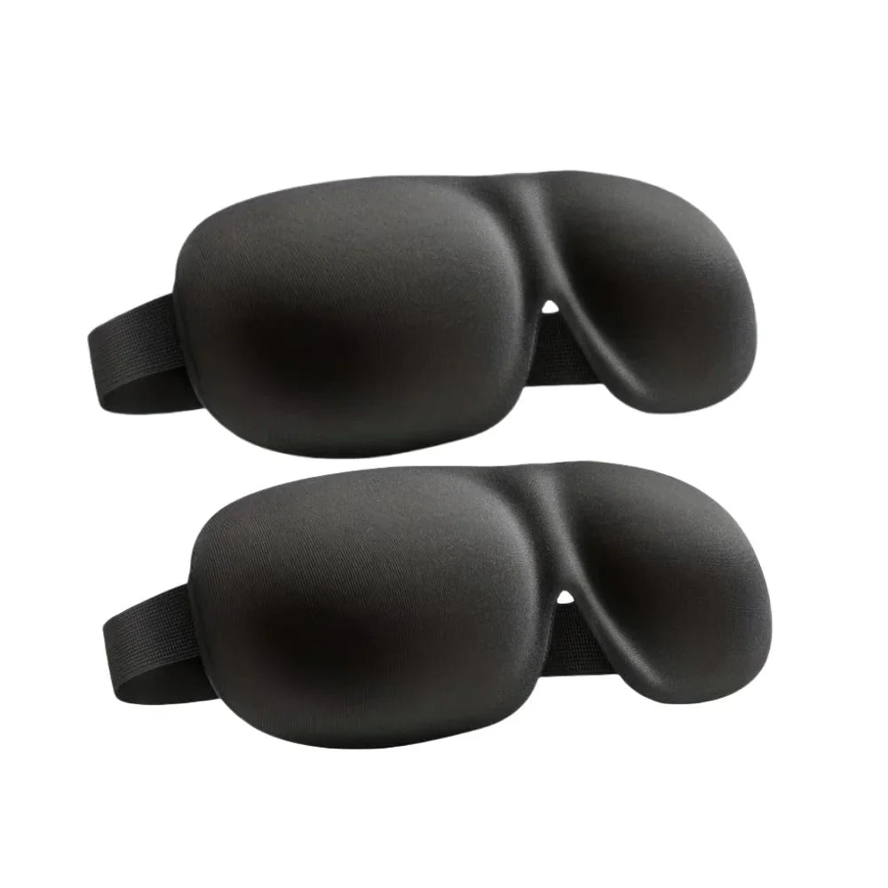 Two black contoured sleep eye masks with elastic straps, side-by-side