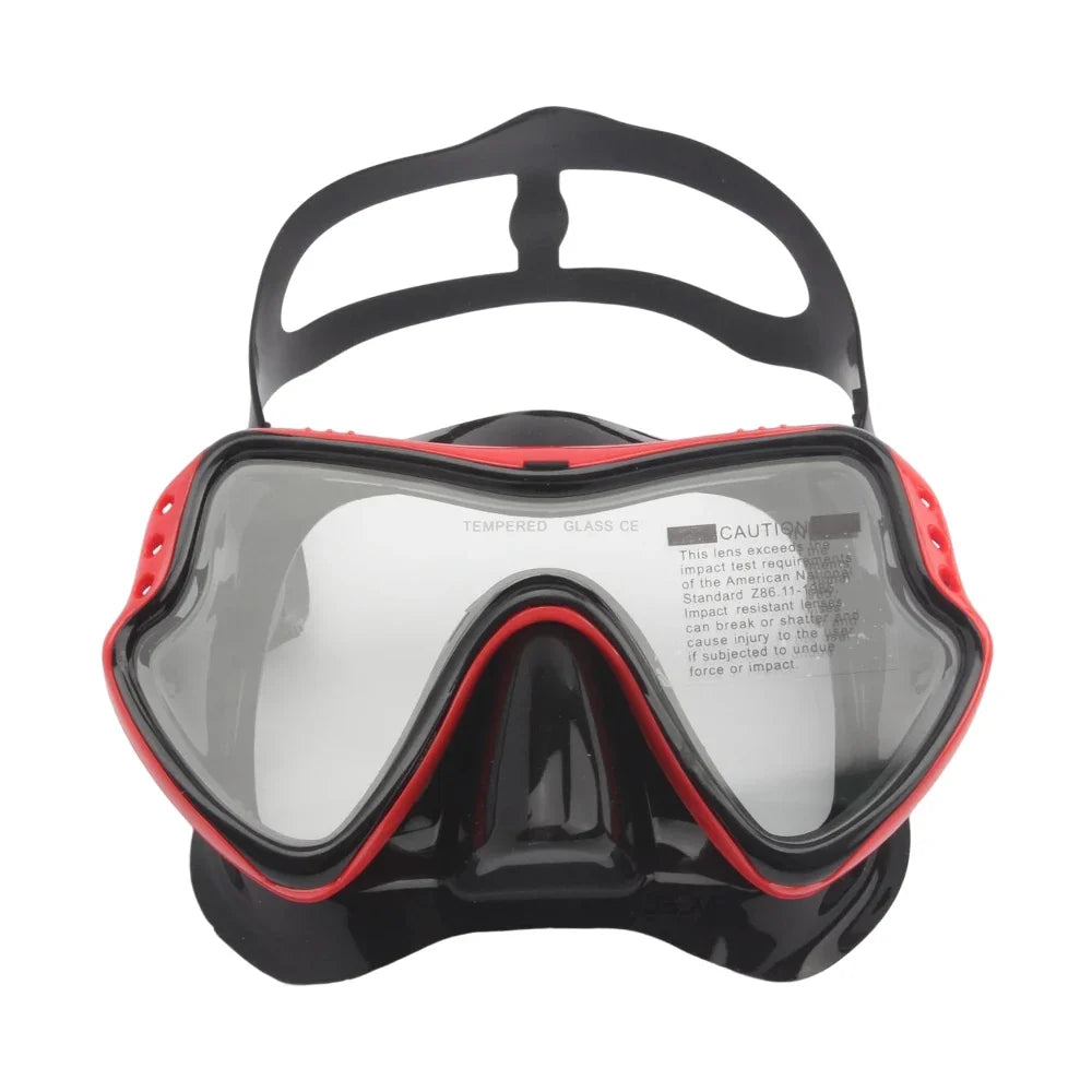 Black diving goggles with red trim, clear tempered lenses, and anti-fog coating