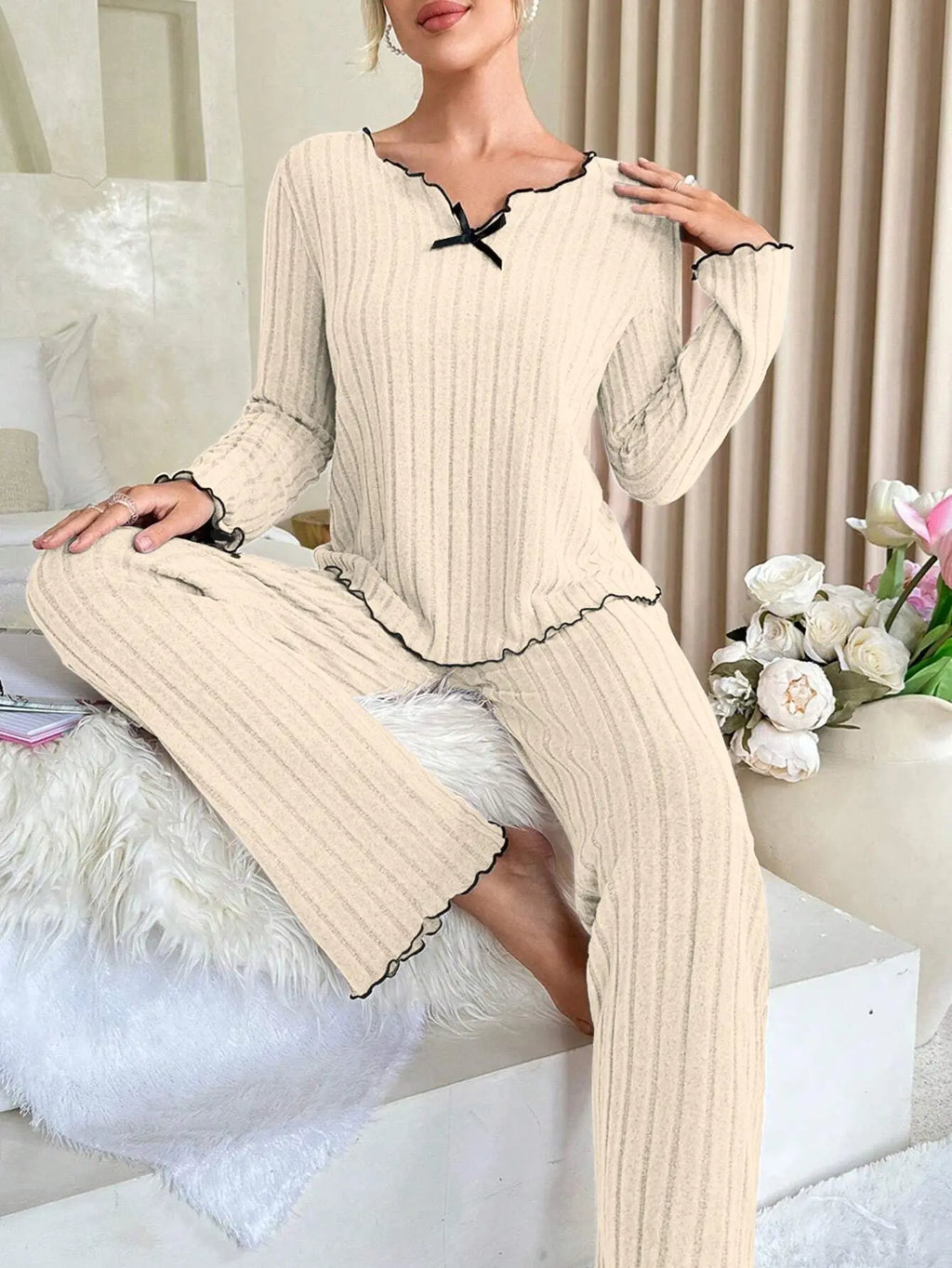 Women’s flannel pajama set with long sleeves, light beige with black trim and bow collar
