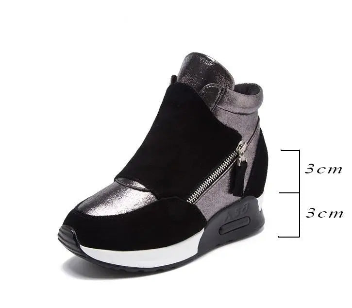 Black ankle boot with faux fur cuff, silver upper panel, side zipper, chunky sole