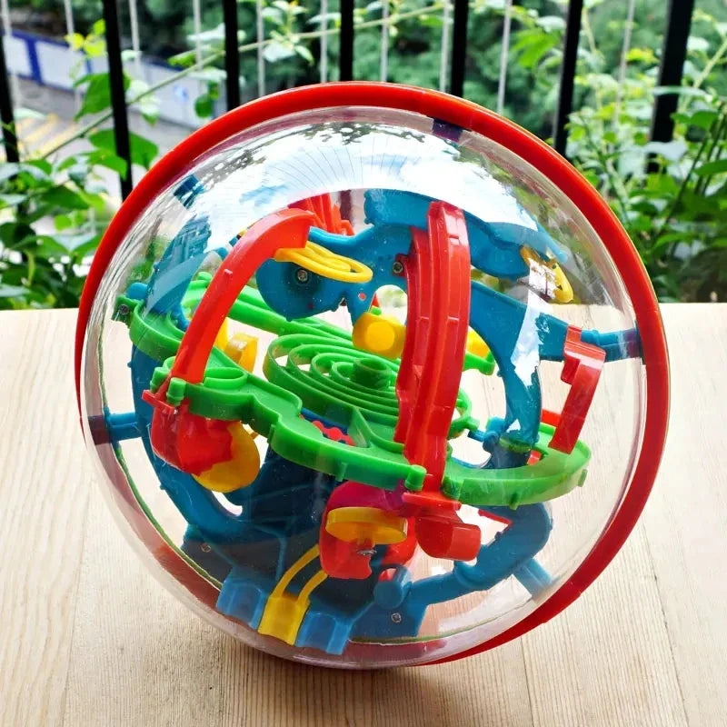3D maze puzzle ball with multicolored labyrinth tracks in clear sphere