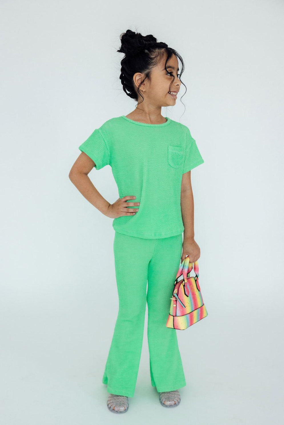 Seafoam green crew-neck short-sleeve top with chest pocket and flared pants